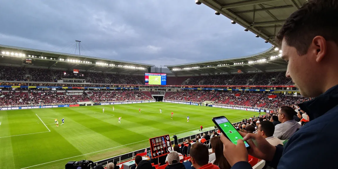 Thrilling sports betting scene with bj88-vnd and live match odds displayed, capturing expert betting predictions.